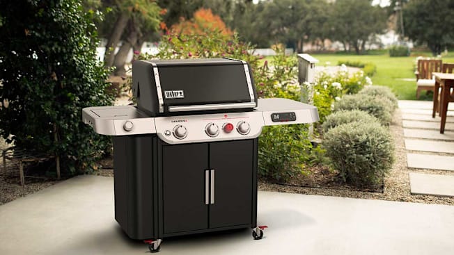 Weber Genesis EX-335 Gas Grill seen on a patio.