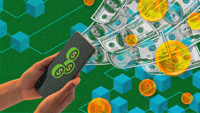 A photo illustration of hands holding a smartphone against a green background patterned with blue 3D hexagonal cubes. On the phone screen, three green coin icons with dollar signs are visible. A stream of one-hundred-dollar bills and glowing orange cryptocurrency coins emerges from the phone, floating toward the upper right corner of the frame. The image has a textured, grainy, halftone dot aesthetic.