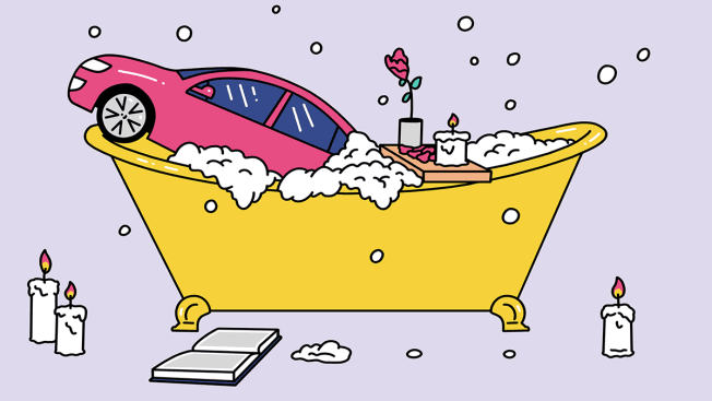 Car doing some self care in a bubble bath with candles.