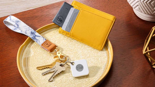 Tile technology shown connected to a key chain and in a wallet.