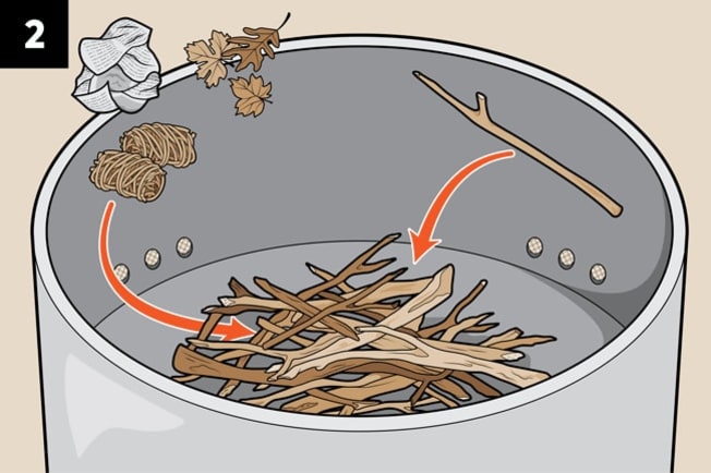 Prepping the tinder in a fire pit