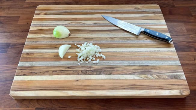 Onion chopped up on a Teakhaus by Proteak Edge Grain Cutting Board