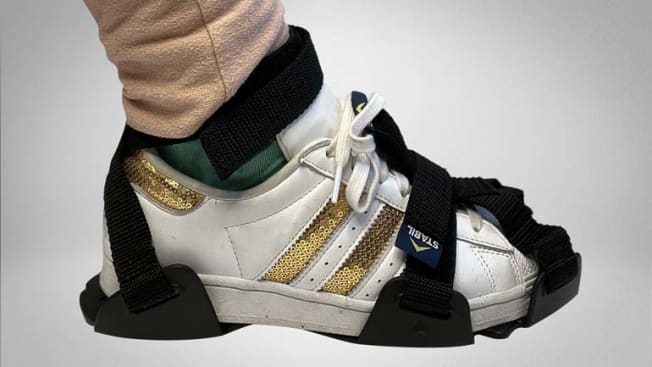 detail of person's foot and ankle showing Stabilicers ice cleats