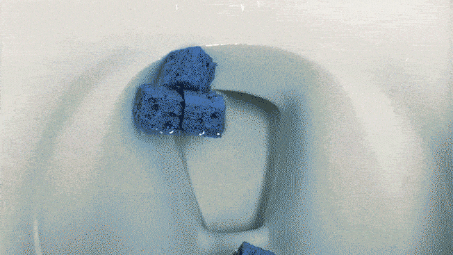 3 blue sponges being flushed down toilet for testing