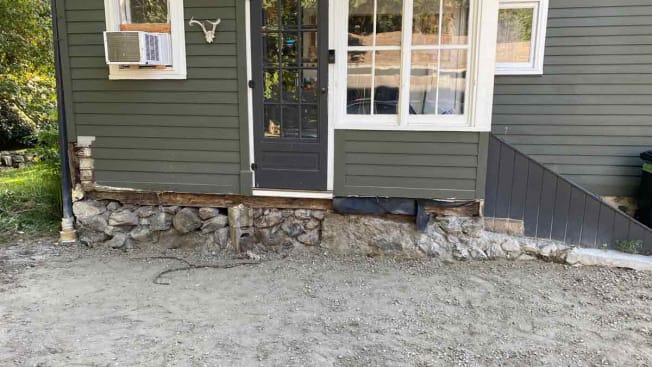 Photo of the deck door with no deck underneath it—just open space.