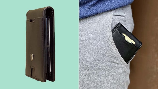 black wallet, wallet sliding into front pocket of pants