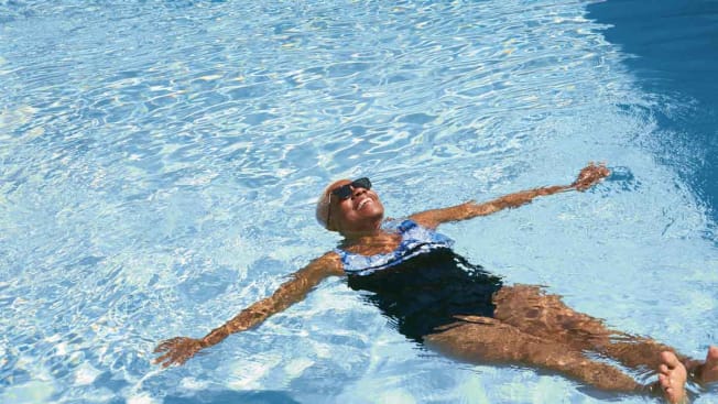 overhead view of person floating on their back in a pool