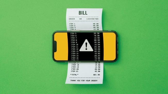 Bill on mobile phone with caution sign