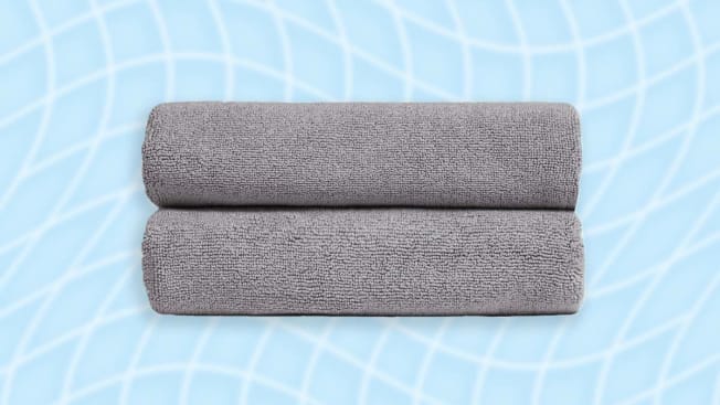 grey Parachute bath towels on a blue and white background