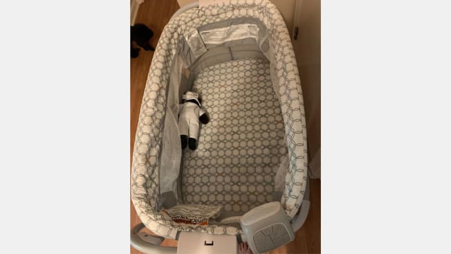 Photo from an Ingenuity Dream & Grow Bassinet incident report from September 2019 with a teddy bear demonstrating the position that the baby was found in.