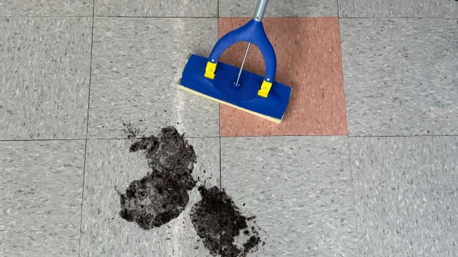 Scrub Daddy Mop being tested with a muddy floor.