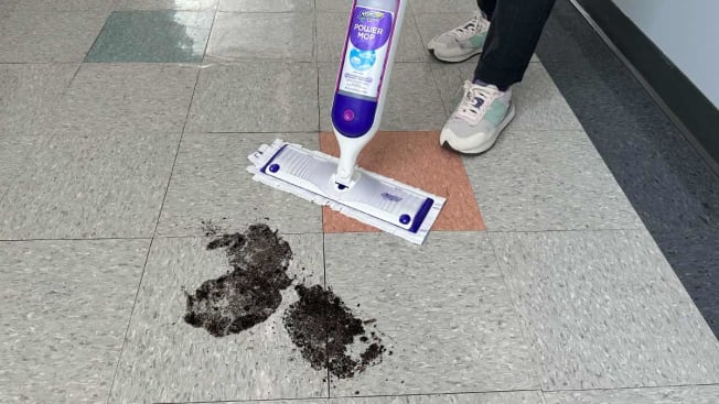Swiffer Power Mop being tested with a muddy floor.