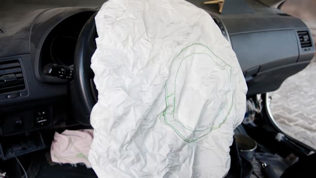 a deployed airbag in a car