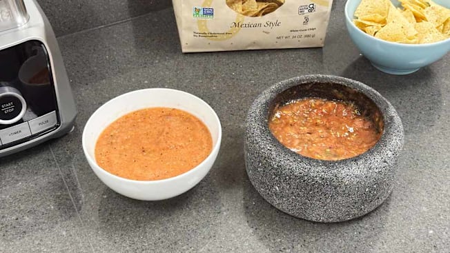 salsa prepared in a blender next to salsa prepared in a Molcajete