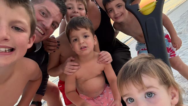 a self-portrait of a family at the beach