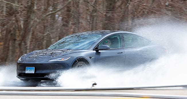 Tesla Model 3 in EV tire testing, hydroplaning resistance, seen from the side