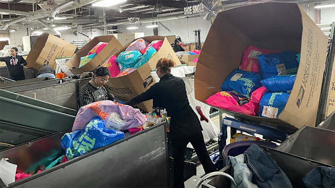 Workers sorting Trashie bags at the warehouse