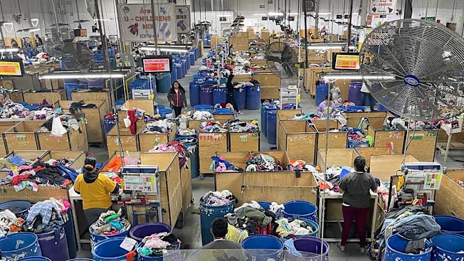 Overhead shot of the clothes being sorted at the Trashie warehouse
