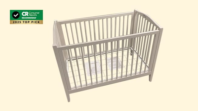 Pottery Barn Kids Emerson Convertible Crib on pale yellow background with CR Recommended 2025 Top Pick graphic in corner