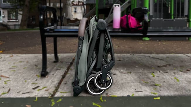 Side view of the Joolz Aer+ Stroller folded and standing upright.