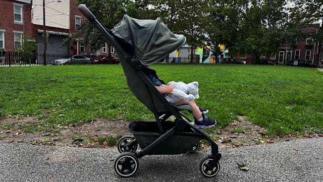 Side view of the Joolz Aer+ Stroller with a toddler in it and the canopy in use.