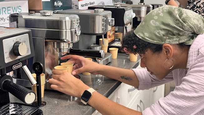 A Consumer Reports employee testing an espresso machine.