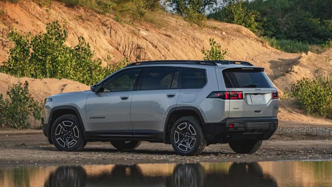 Rear and side view of a parked 2026 Jeep Cherokee in an outdoor setting.