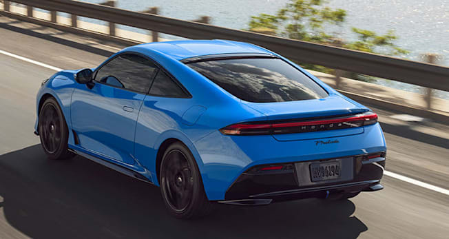 2026 Honda Prelude, high rear photo of a blue car driving