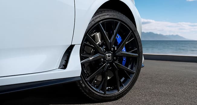 White 2026 Honda Prelude with black wheel and blue brake caliper.