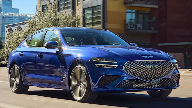 2025 Genesis G70 driving in a city