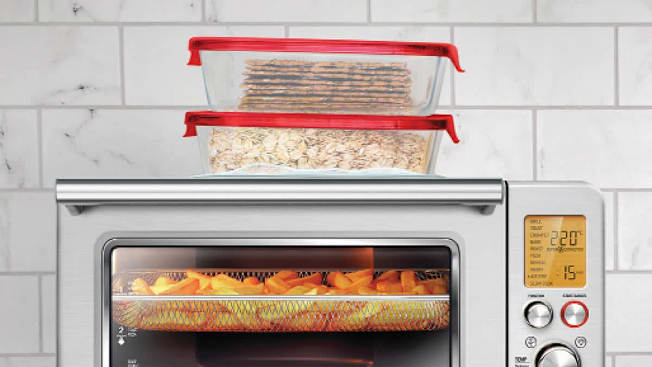 Photo illustration showing a melted plastic container on top of a hot toaster oven.
