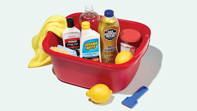 A plastic caddy toolkit containing several common cleaning products