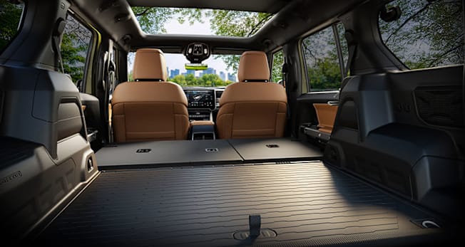 2026 Jeep Recon Electric SUV with back seats folded, showing a flat cargo floor.