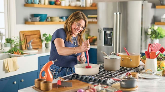 Rachel Ray cooking  and using a meat chopper