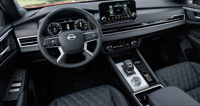 2026 Nissan Rogue Plug-in Hybrid Platinum interior showing the dash board and controls