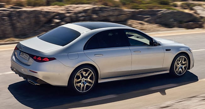 2027 Mercedes-Benz S-Class photographed from behind and above while driving on a two-lane road.