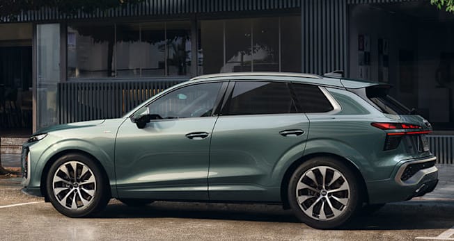 2026 Audi Q3 driving, rear, parked curbside