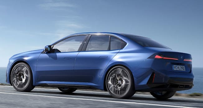 2027 BMW i3 electric sedan driving, rear