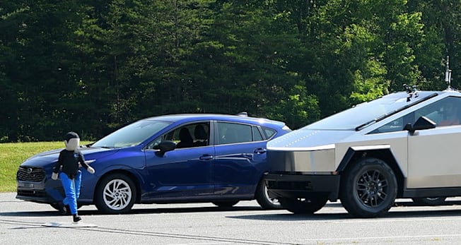 IIHS conducting the pedestrian front crash prevention test with a Tesla Cybertruck