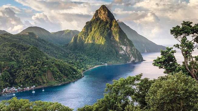 Piton mountains of Saint Lucia rising dramatically from the bright blue Caribbean Sea.