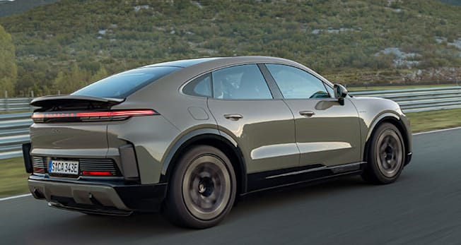 2026 Porsche Cayenne Coupe shown from rear driving