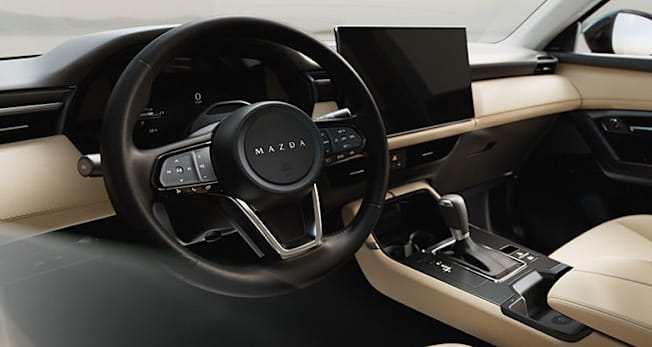 2026 Mazda CX-5 interior seen through driver's window