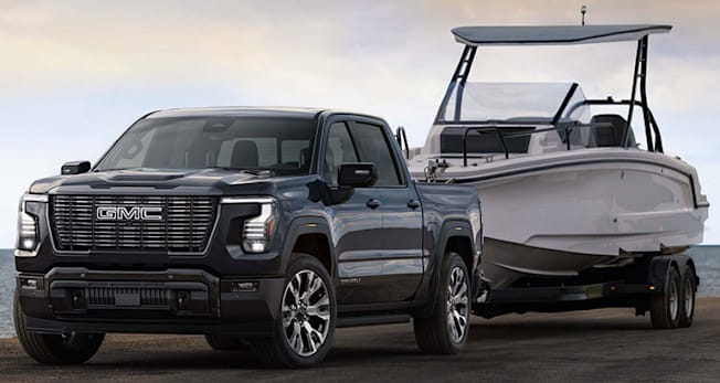 2027 GMC Sierra 1500 Ultimate towing a boat