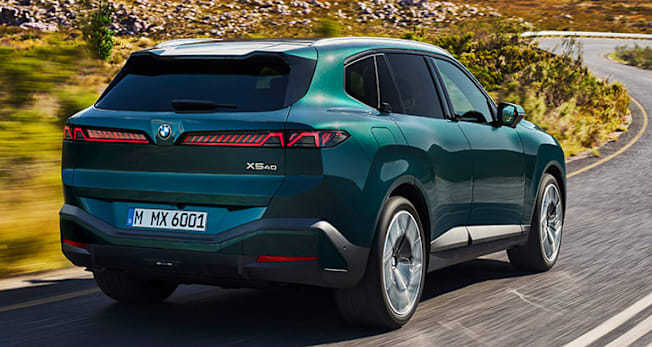 Rear view of 2027 BMW X5 40 being driven.