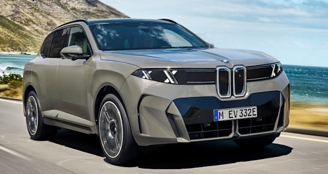 2027 BMW iX5 driving along coast