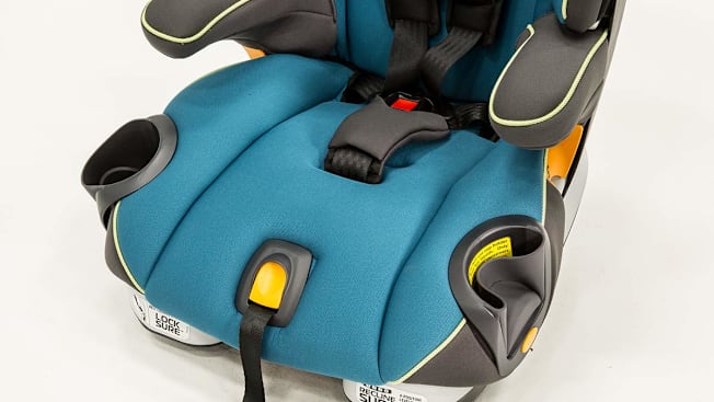 Detail of a car seat that shows a collapsable cup holder.