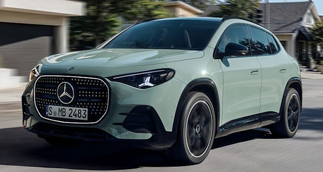 2028 Mercedes-Benz GLA driving through a neighborhood, front