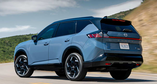 2027 Nissan Rogue Hybrid SR driving, rear