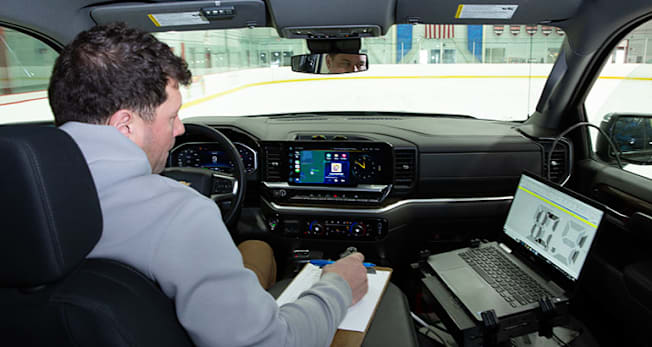 Consumer Reports Tire Manager Ryan Pszczolkowski runs the testing equipment that is used to measure braking distances on ice.