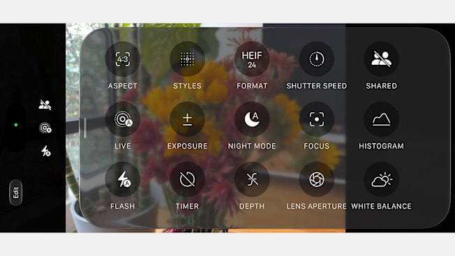 A semi-transparent camera settings menu overlaying a blurred viewfinder image of colorful flowers. The menu displays circular icons labeled for controls like Aspect, Styles, Format, Exposure, Night Mode, Flash, and White Balance.